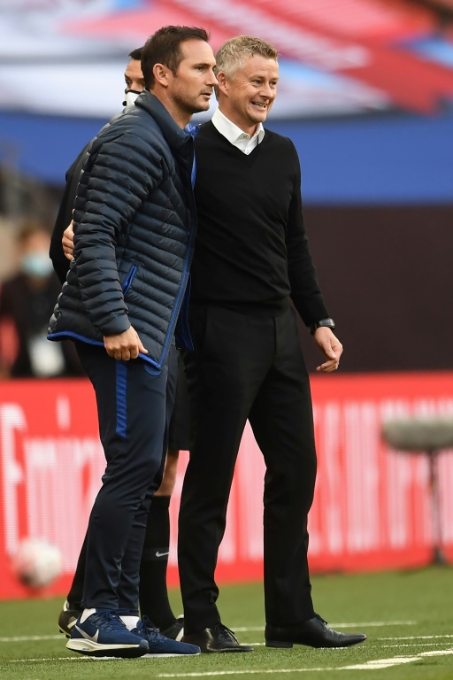 Les entraîneurs de Chelsea Frank Lampard (g) et de Manchester United Ole Gunnar Solskjaer lors de la demi-finale de Coupe d'Angleterre, le 19 juillet 2020 au stade de Wembley à Londres